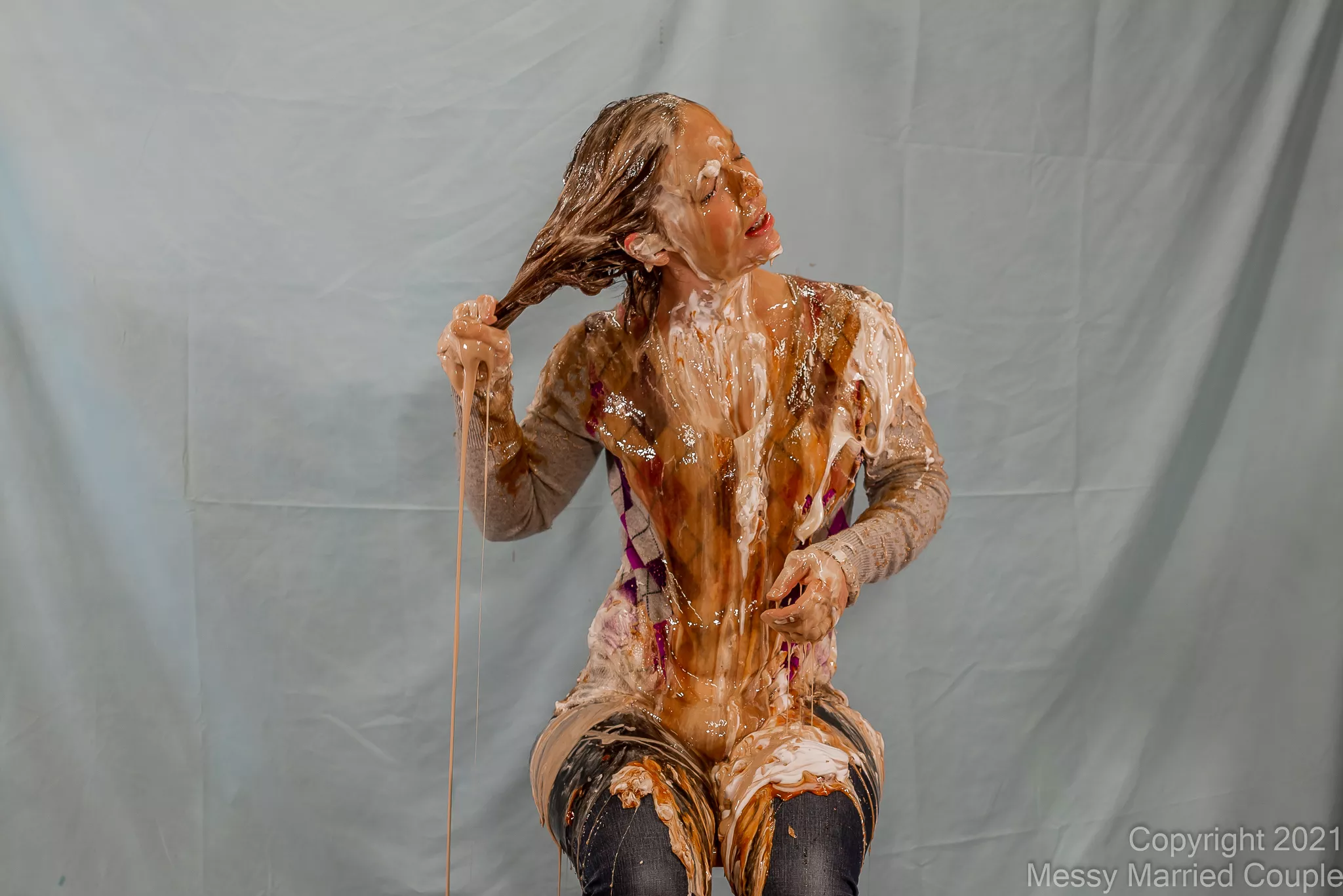 Wringing out maple syrup from her hair