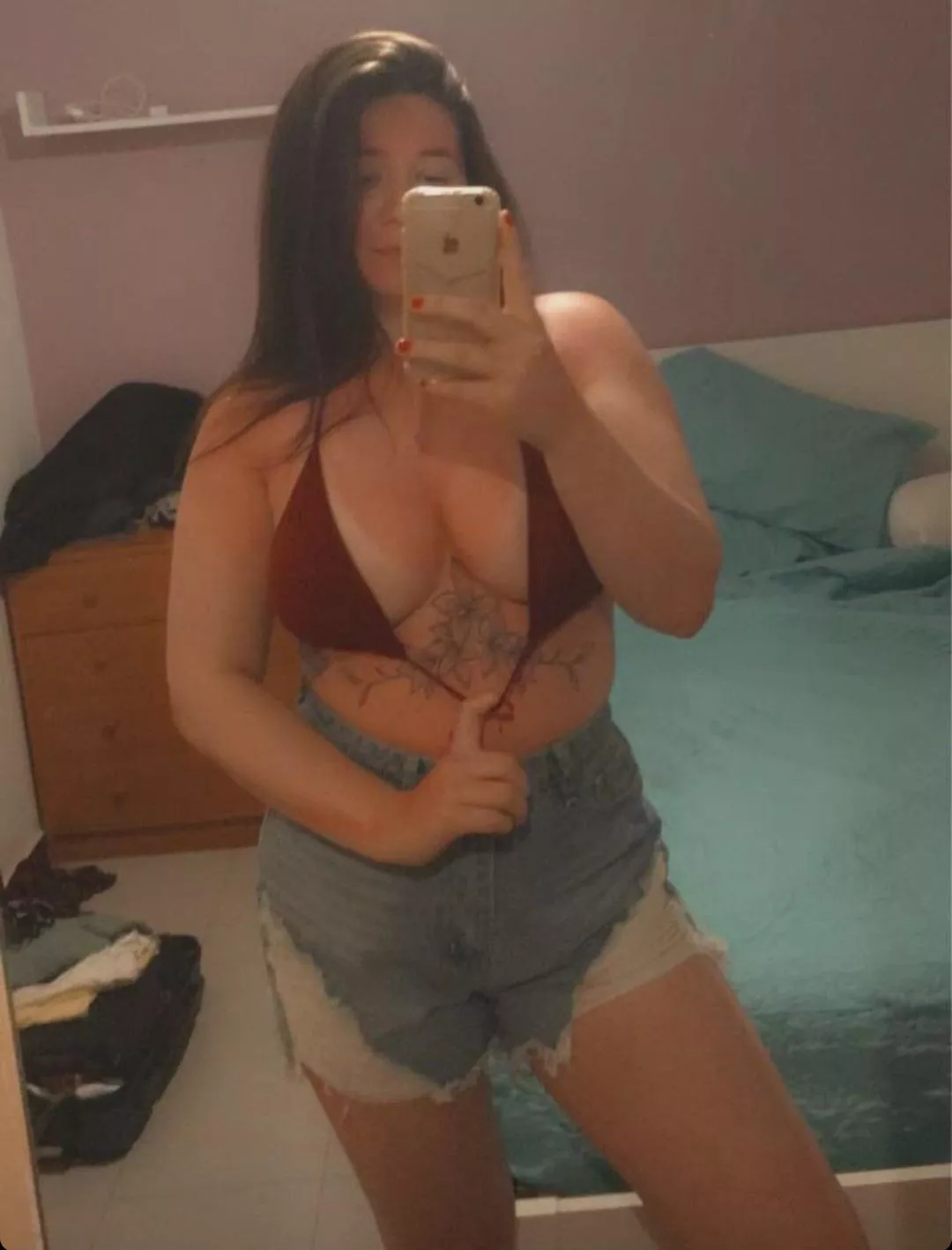 Does she wanna show her sun burn off or tease her tits😉