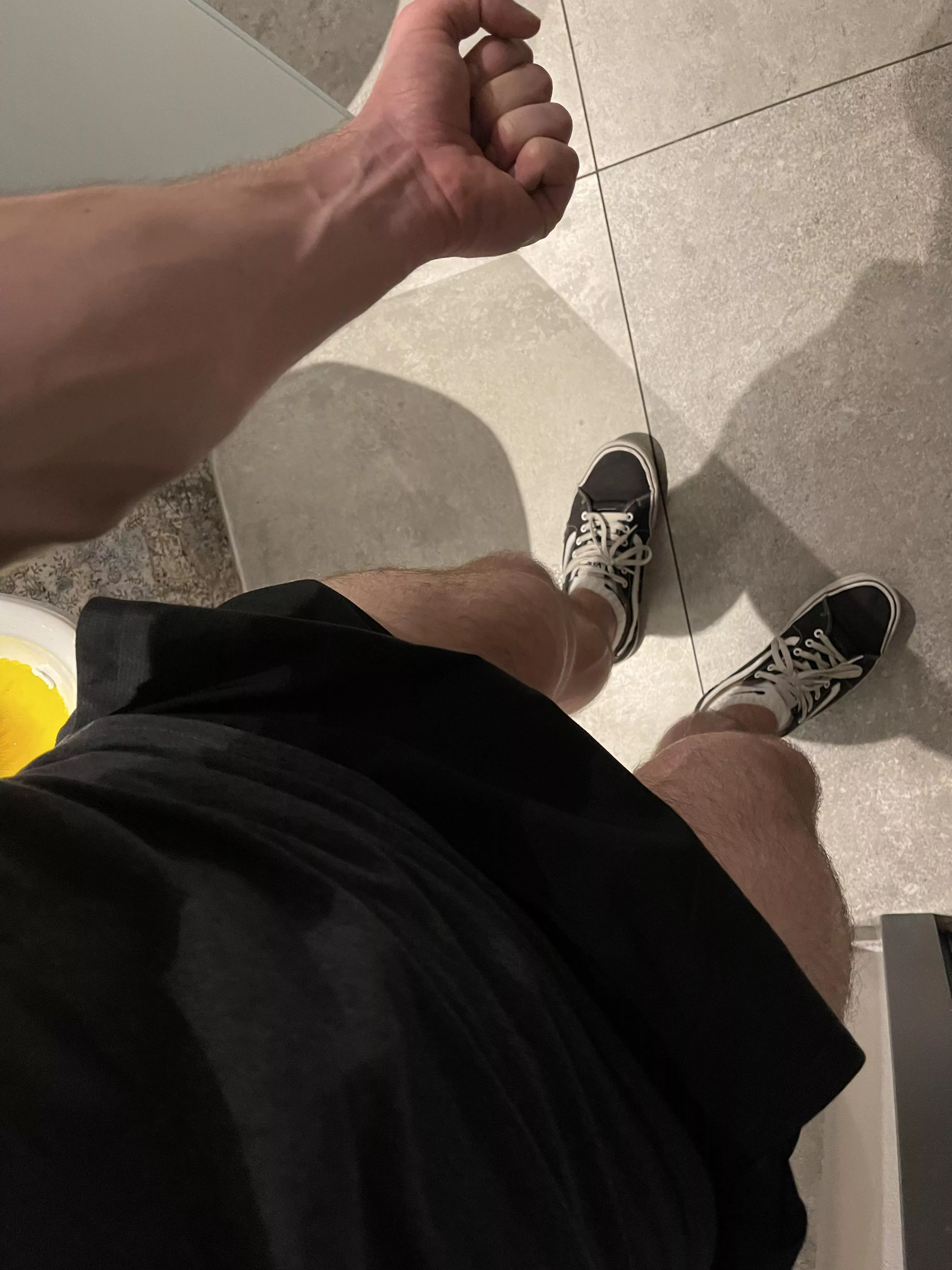 Forearm next to the toilet