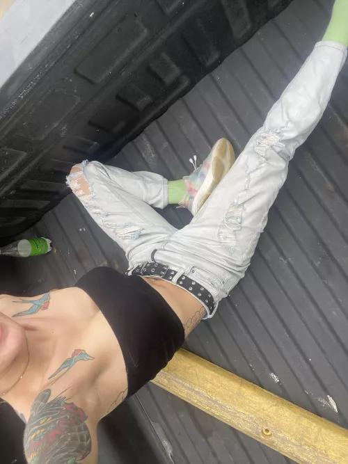 In the back of a pick up with a little piece of cloth hanging for dear life 😛😅😅