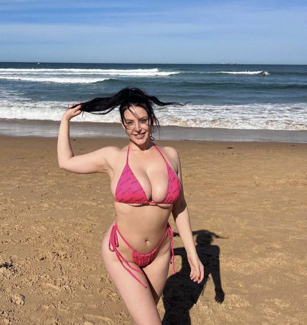 Just a nice girl in a a pink bikini at the beach