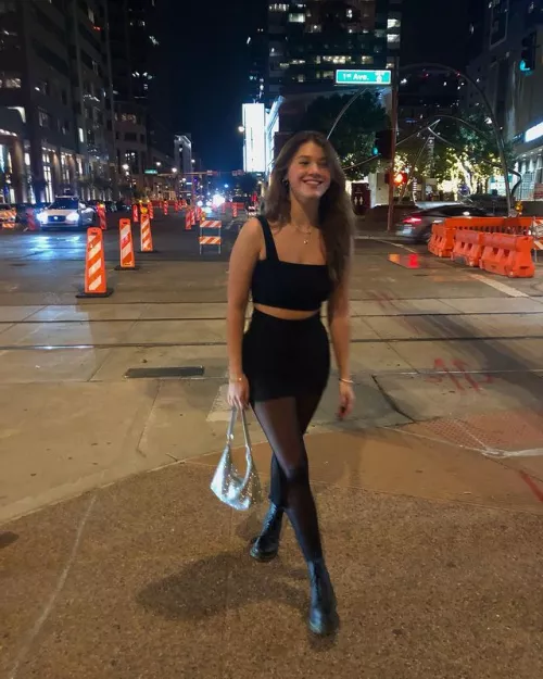 Looking like she's walking back home after some fun...