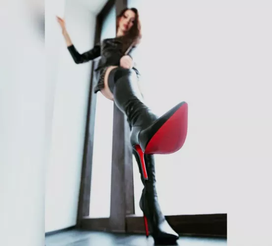 Miss Alexandra’s latex catsuit and OTK red soles