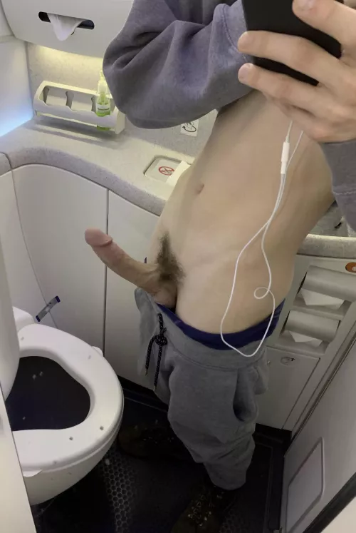 My cock was spilling out of my sweatpants on the plane