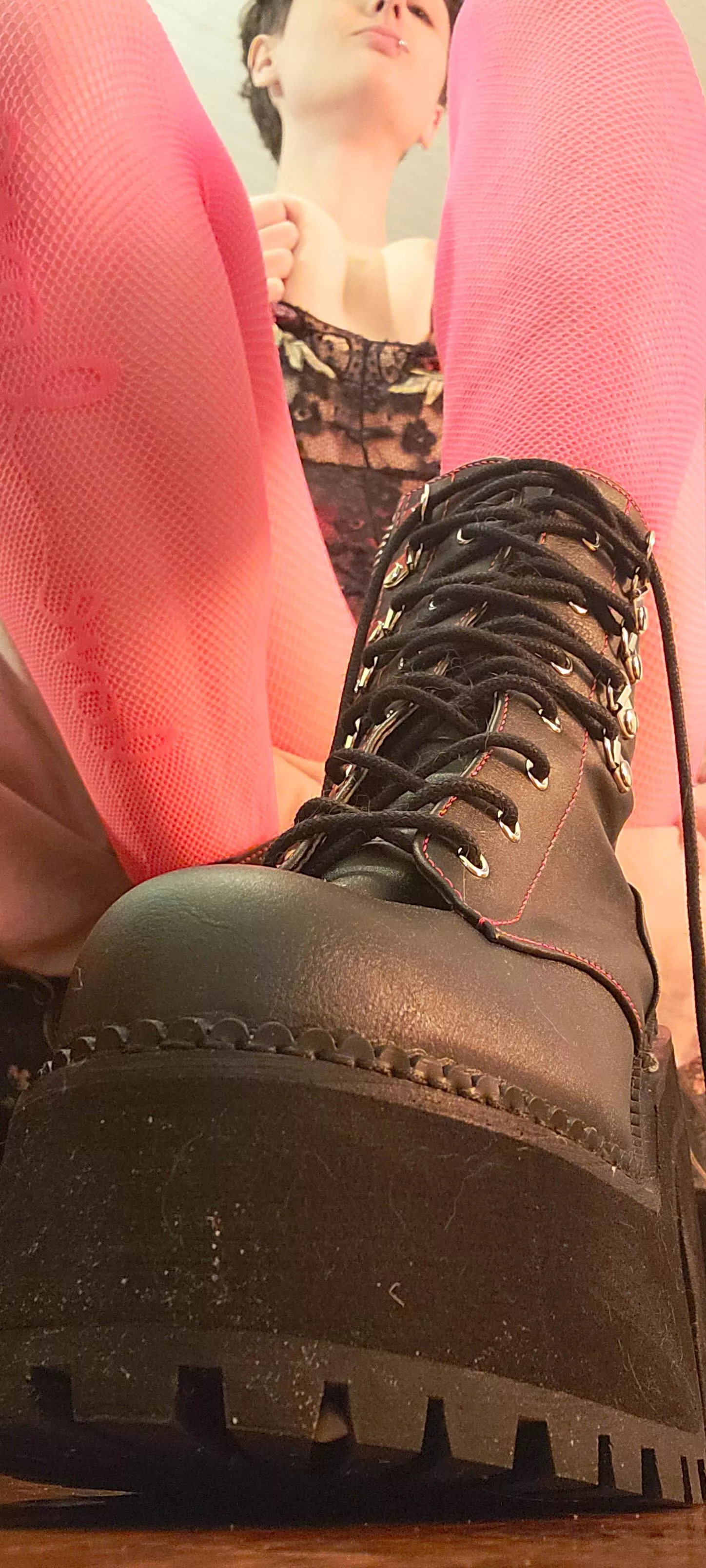 pink fishnet tights and black boots