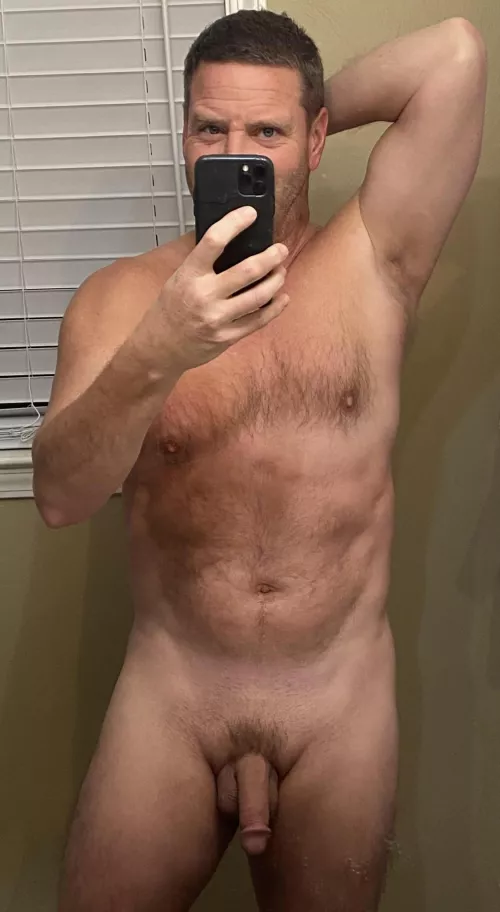 Smirking behind the camera