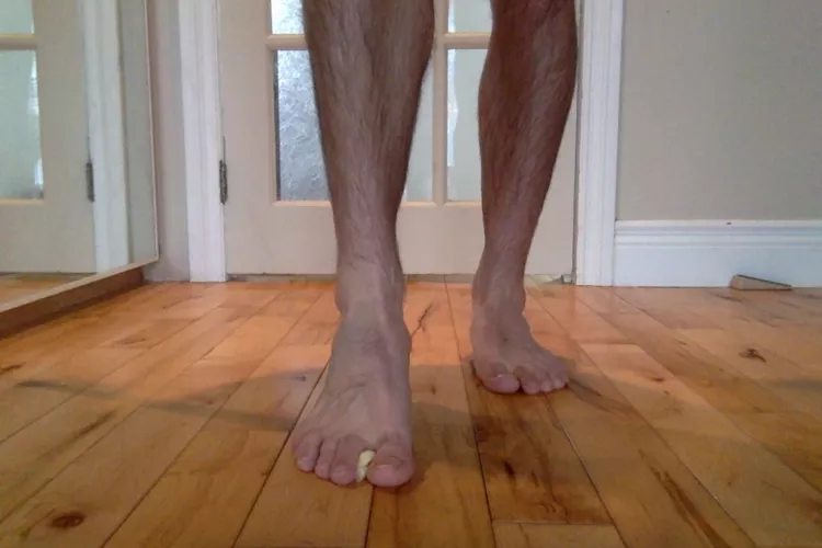 toying with a banana with bare feet !