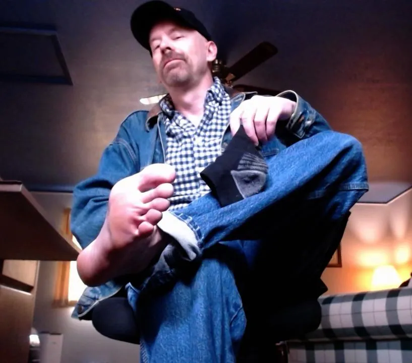 Bare dad feet in the backwoods