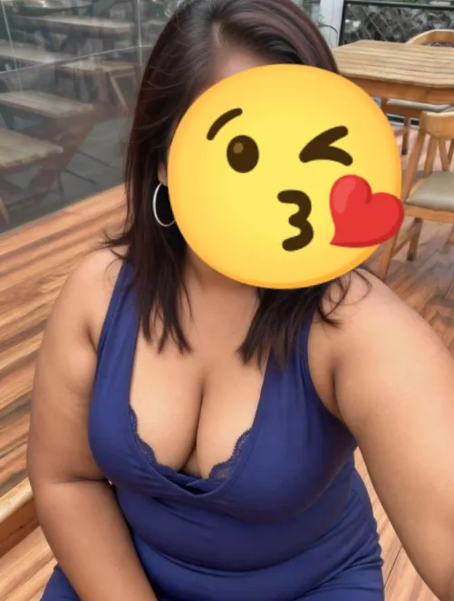 Blue dress, big energy - trying to be the center of attraction in the early evening crowd while hubby went to grab some mocktails Snug fit hugging every inch, plunging neckline daring you to look lower Outdoor glow, red lips, and that “you know you wan