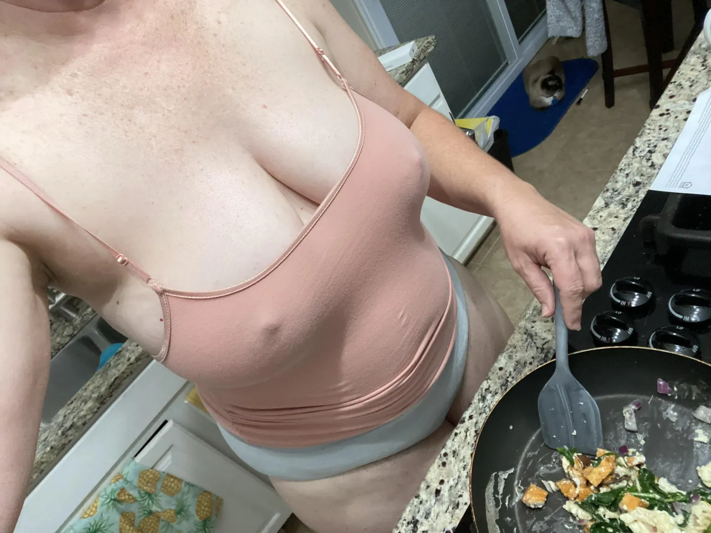 Braless selfie while doing meal prep.