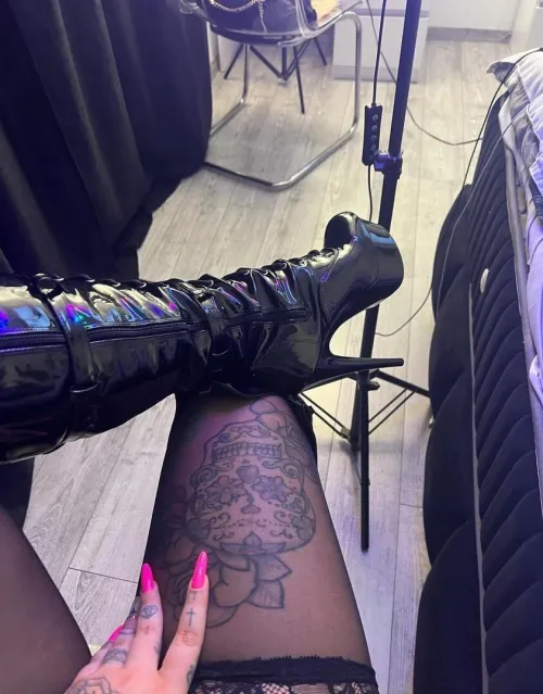 Delicate stockings and shiny boots