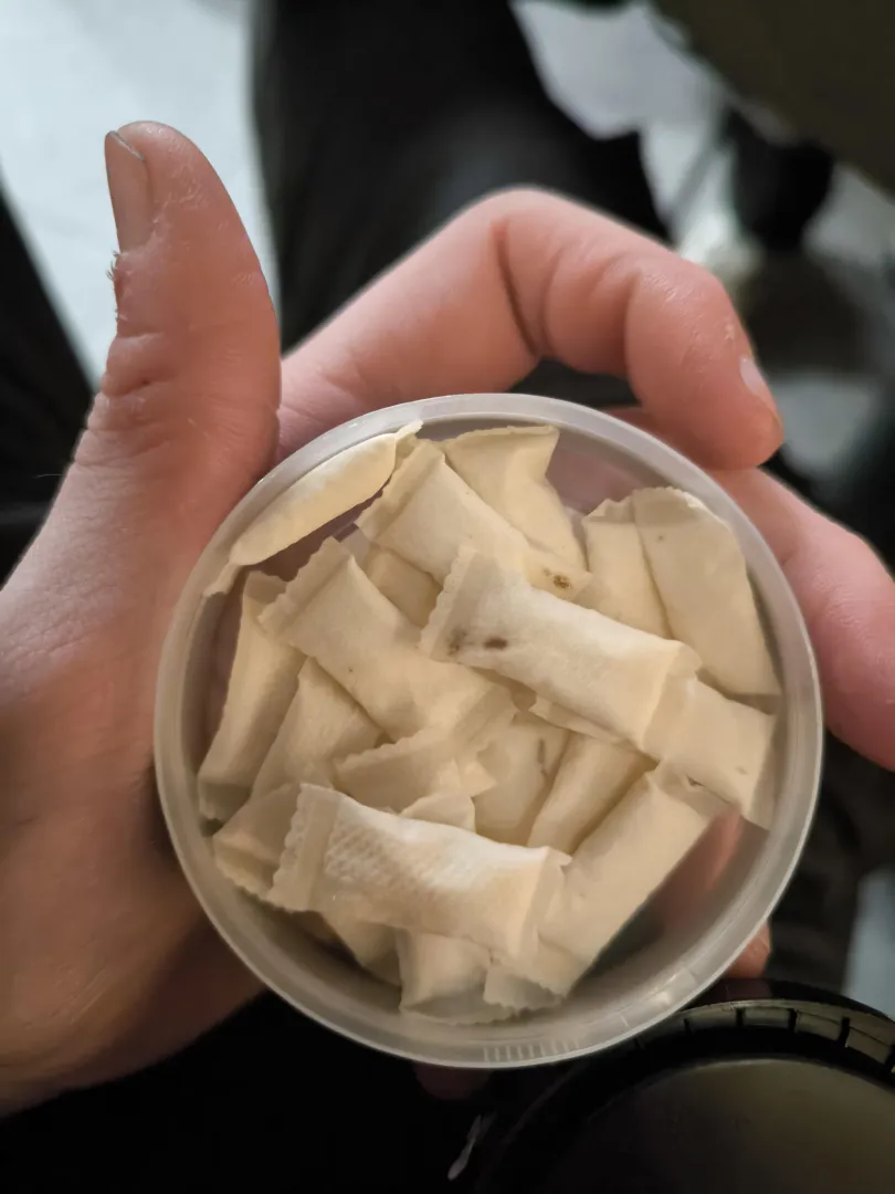 Hey my fresh pot has these dots on the pouch but idk what these are i've been using pouches daily for over 2 years and haven't seen a fresh pot like this. Kinda looks like used one when i use one after a meal but it wad unopened from a regulated tobbac