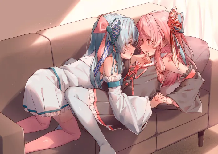 Holding hands on a sofa