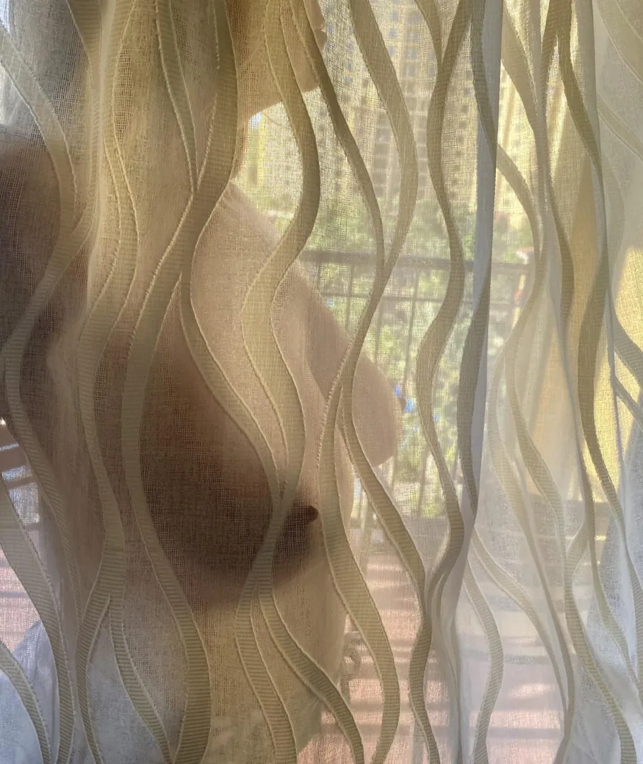 Hubby caught me on the hotel balcony through the sheer curtains