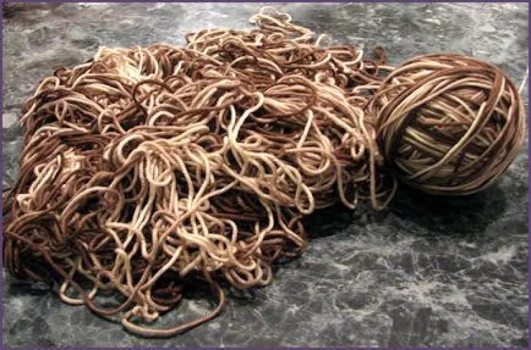 I understand the first part of knitting, but afterwards it curls up and I get these uneven stitches. What am I doing wrong?