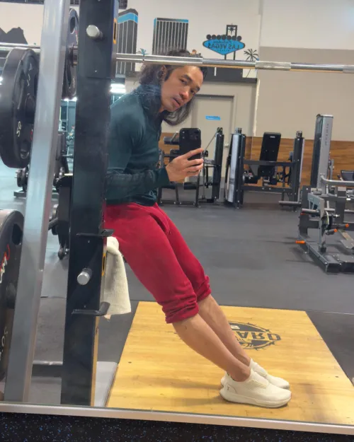 Long Haired Asian Man, Red Joggers, Gym Bulge