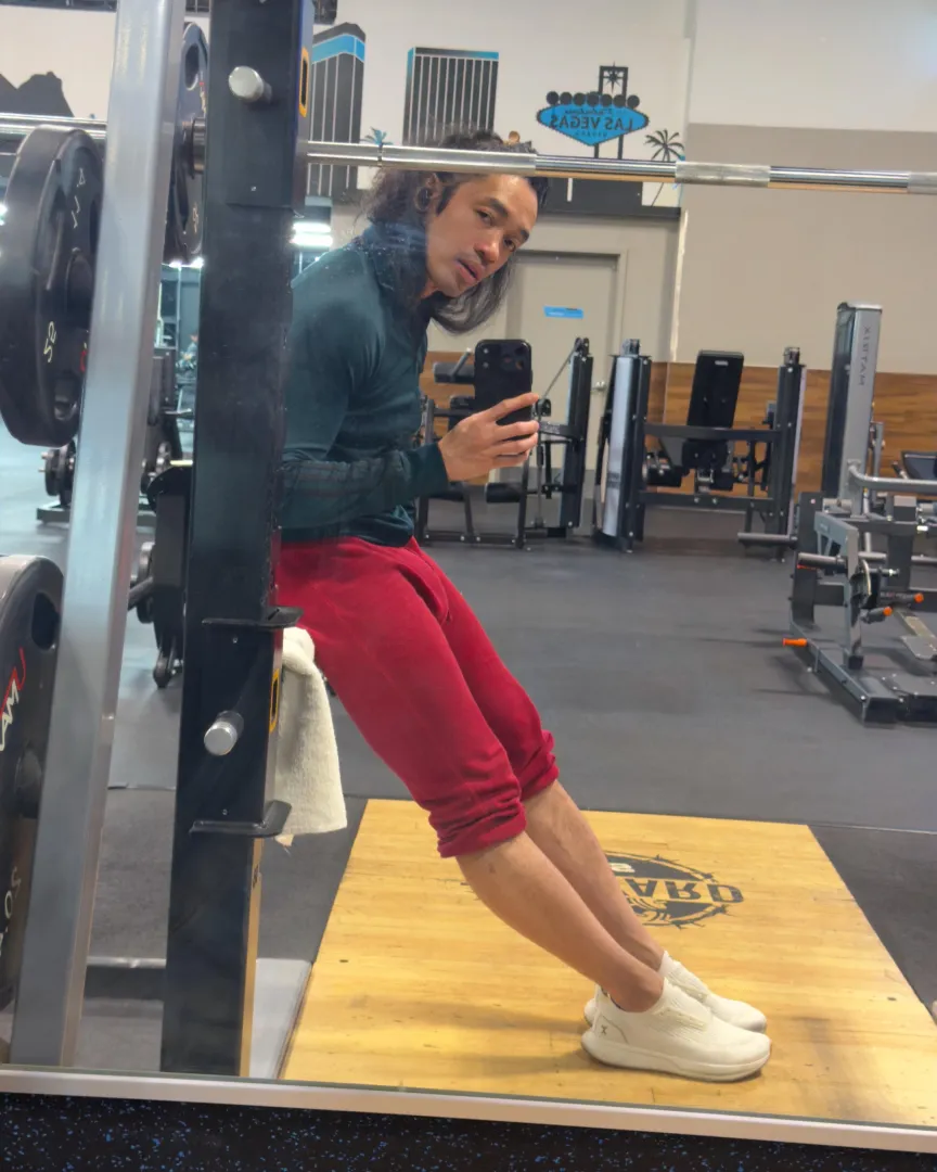 Long Haired Asian Man, Red Joggers, Gym Bulge