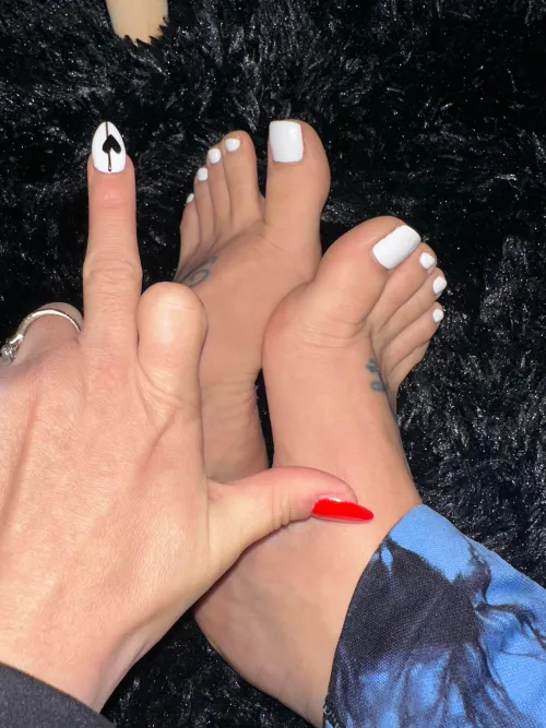 My perfectly painted white toes & middle finger control your life.