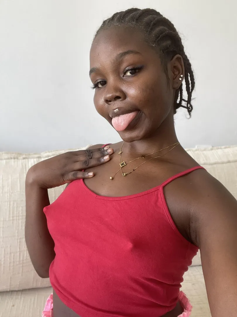 My red tank top is a little thin today. And I'm not wearing no bra