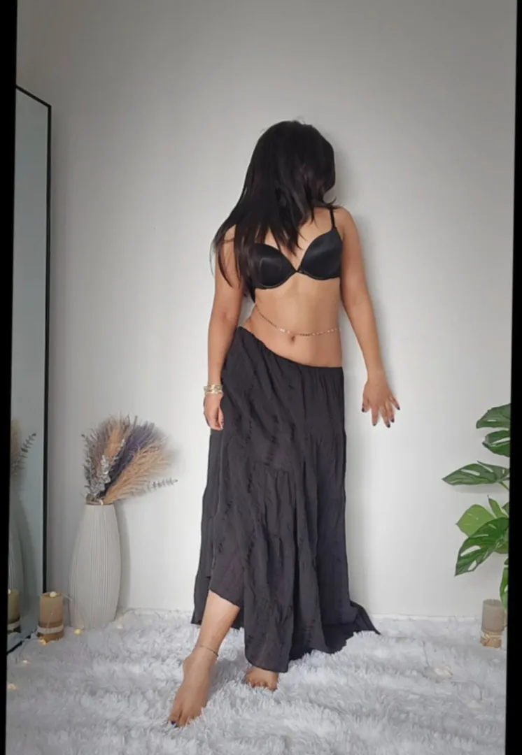 mysterious and curvy in this black skirt.