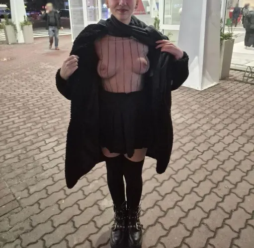 Nothing under the coat but a tiny skirt and sheer top. Flashing tits outside a busy shop on a cold night