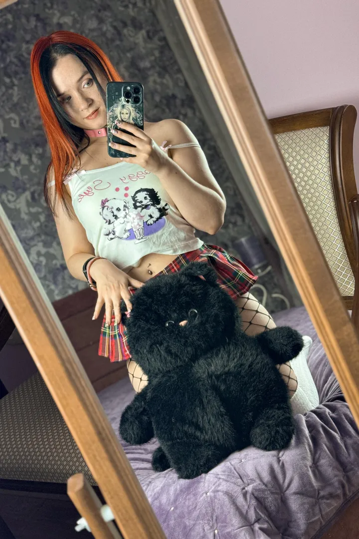 One kitty is covering the other 