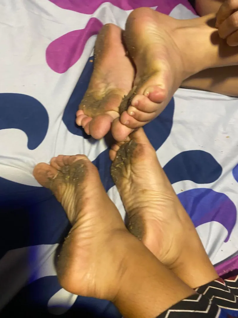 Two pretty girls, and two sets of dirty feet
