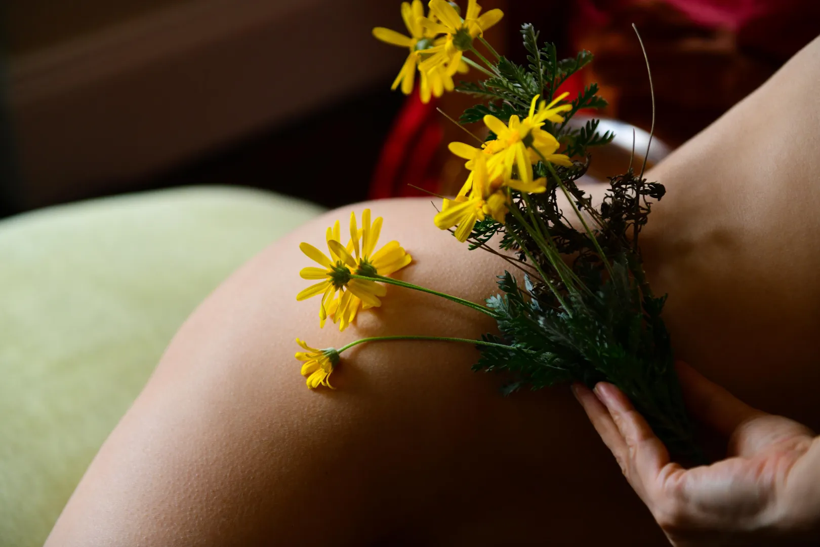yellow winter flowers and naked skin