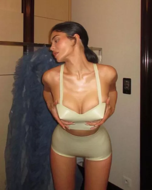 Holds breast (IG post)