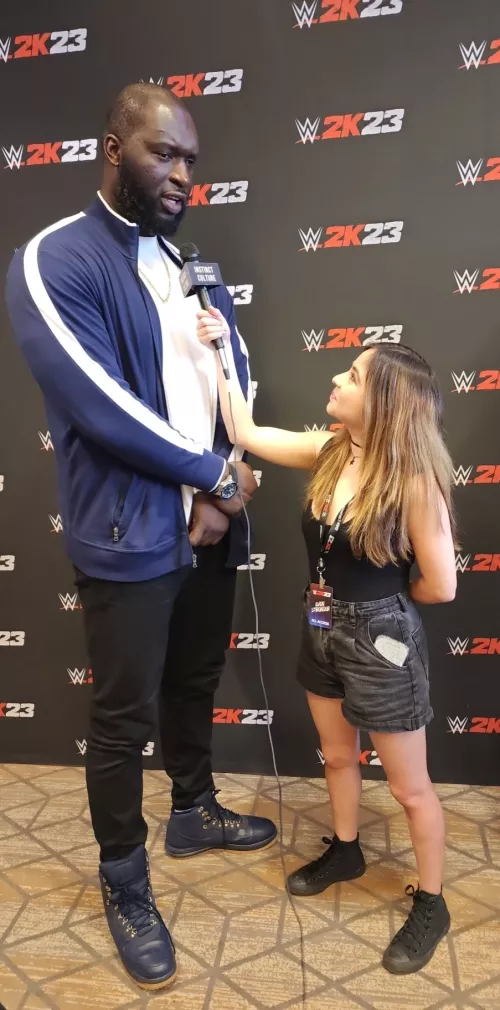 WWE wrestler Omos vs reporter Denise Salcedo