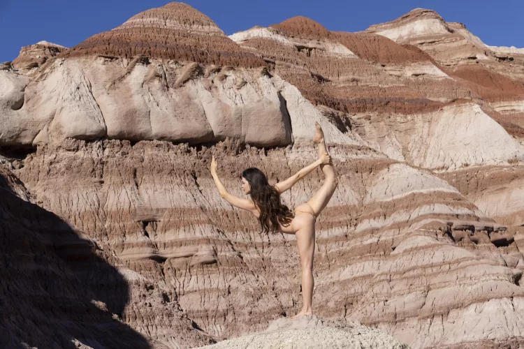 Balancing nude dancer pose