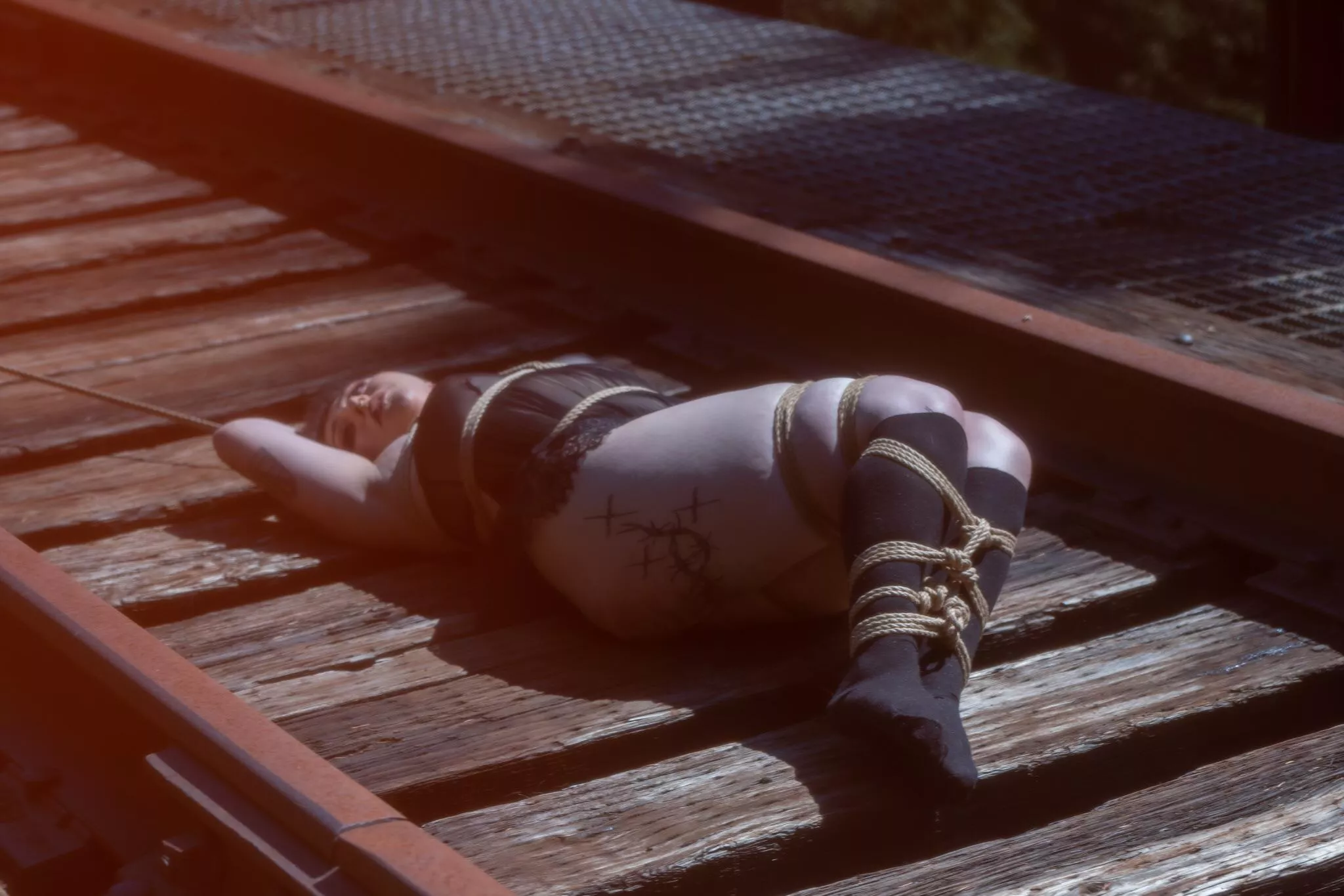 tied up a hot babe on abandoned railroad tracks 🫠