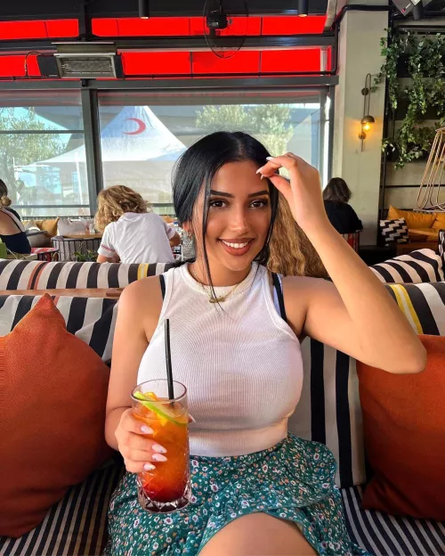 She smiles to get your eyes up to hers