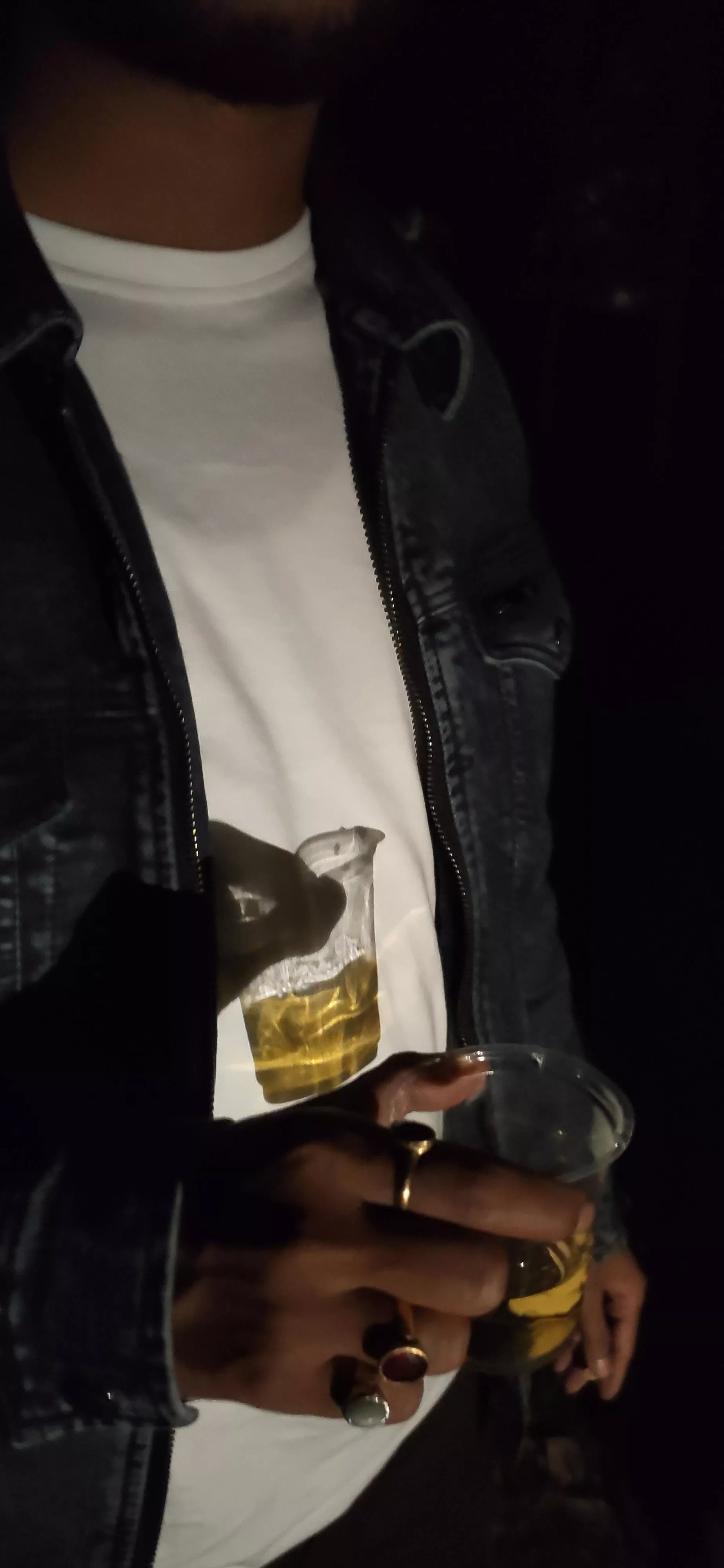 Captured this pic of my friend holding a glass of a drink at a party.