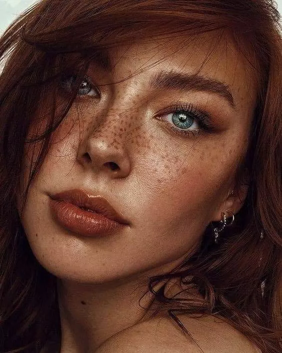 Freakled face blue eyed redhead