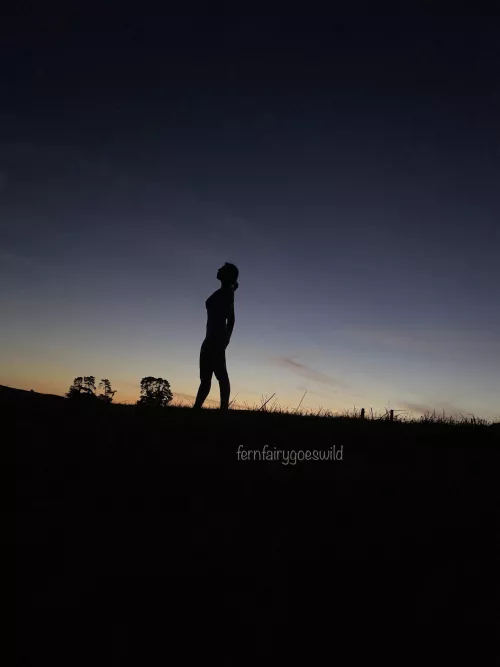 Sunset silhouette of nude woman