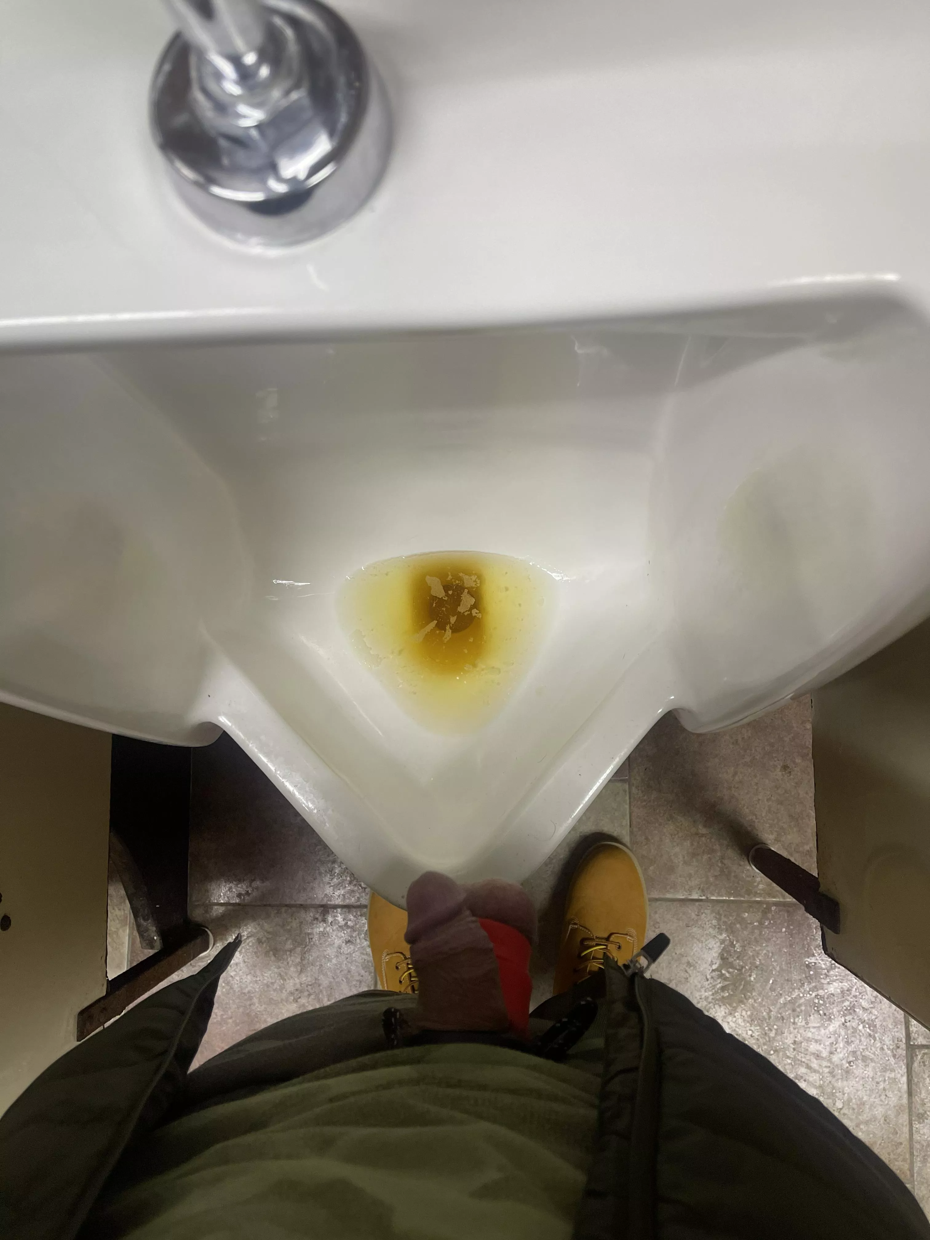 Waiting for someone to walk in the truck stop bathroom