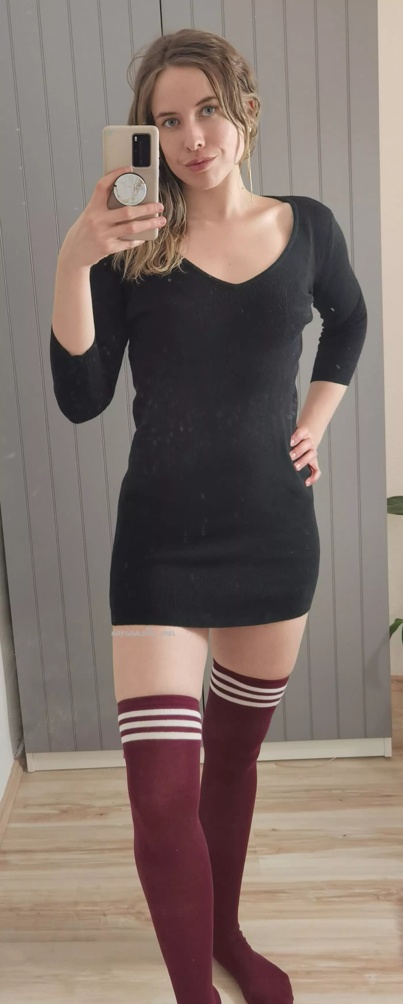 Black dress with red thigh highs. How do I look?