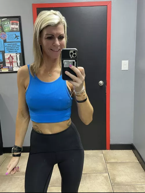 Just a MILF in the gym with some hard nipples and a very real smile!