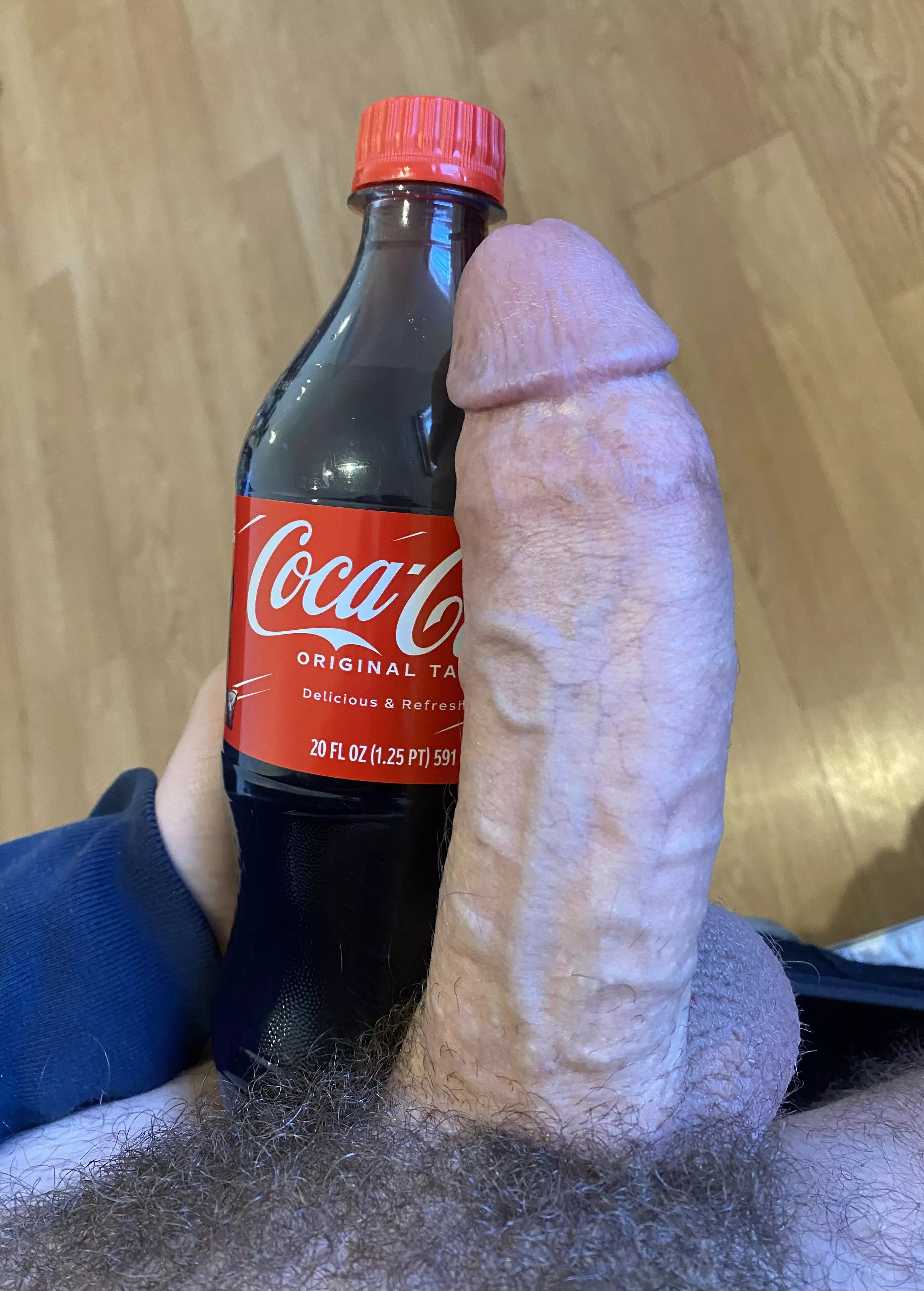 Cock Compared to a coke bottle