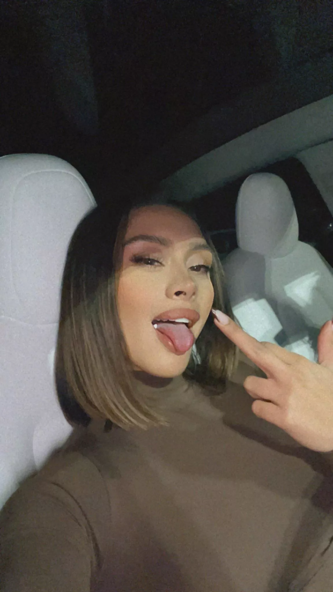 Tongue out and flipping you off