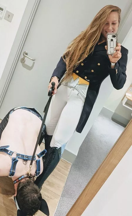 Her pet cleans Her Boots before She goes Riding