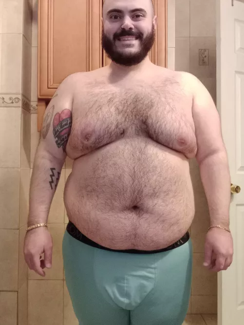 Showing off the chest hair and tattoos