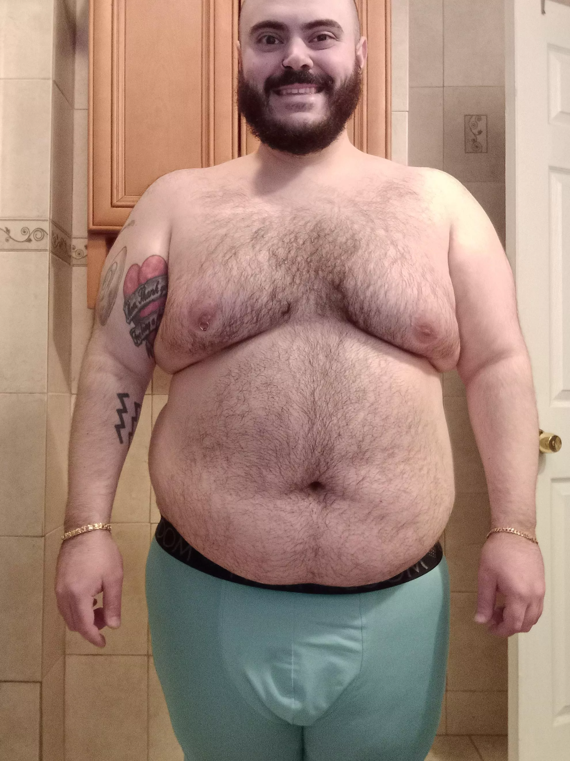 Showing off the chest hair and tattoos