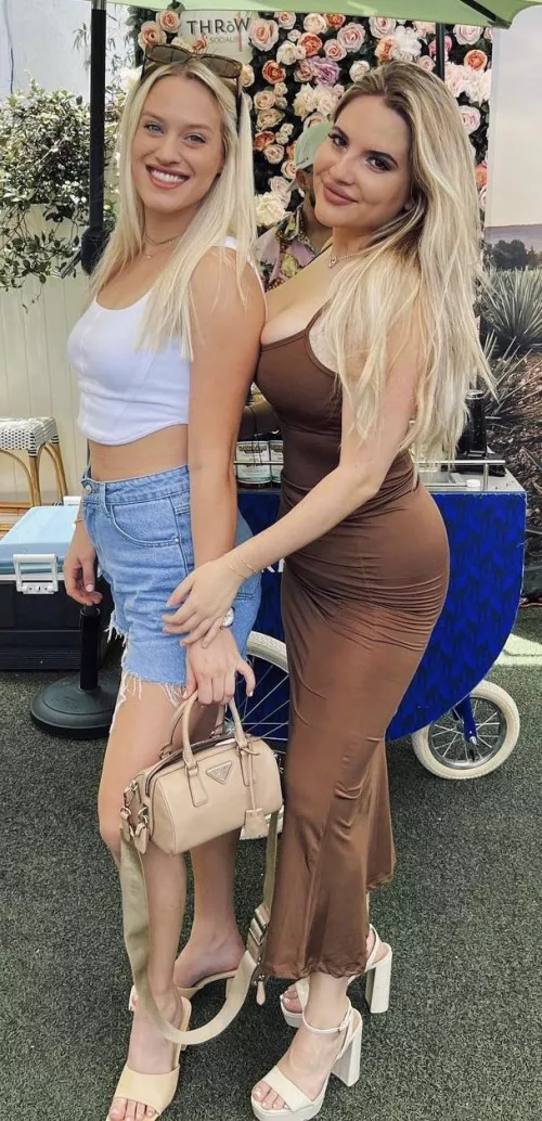 Squishing them against her friend’s back