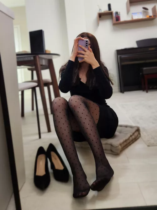 Asian legs in tights with polka dots