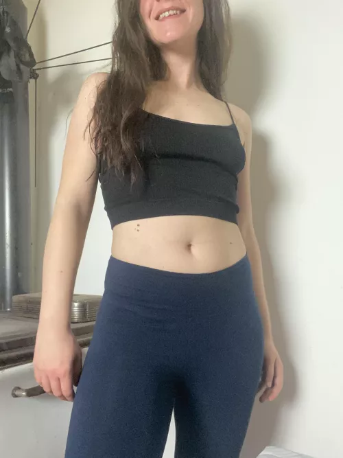 Smiling and looking cute while warming my butt on the stove