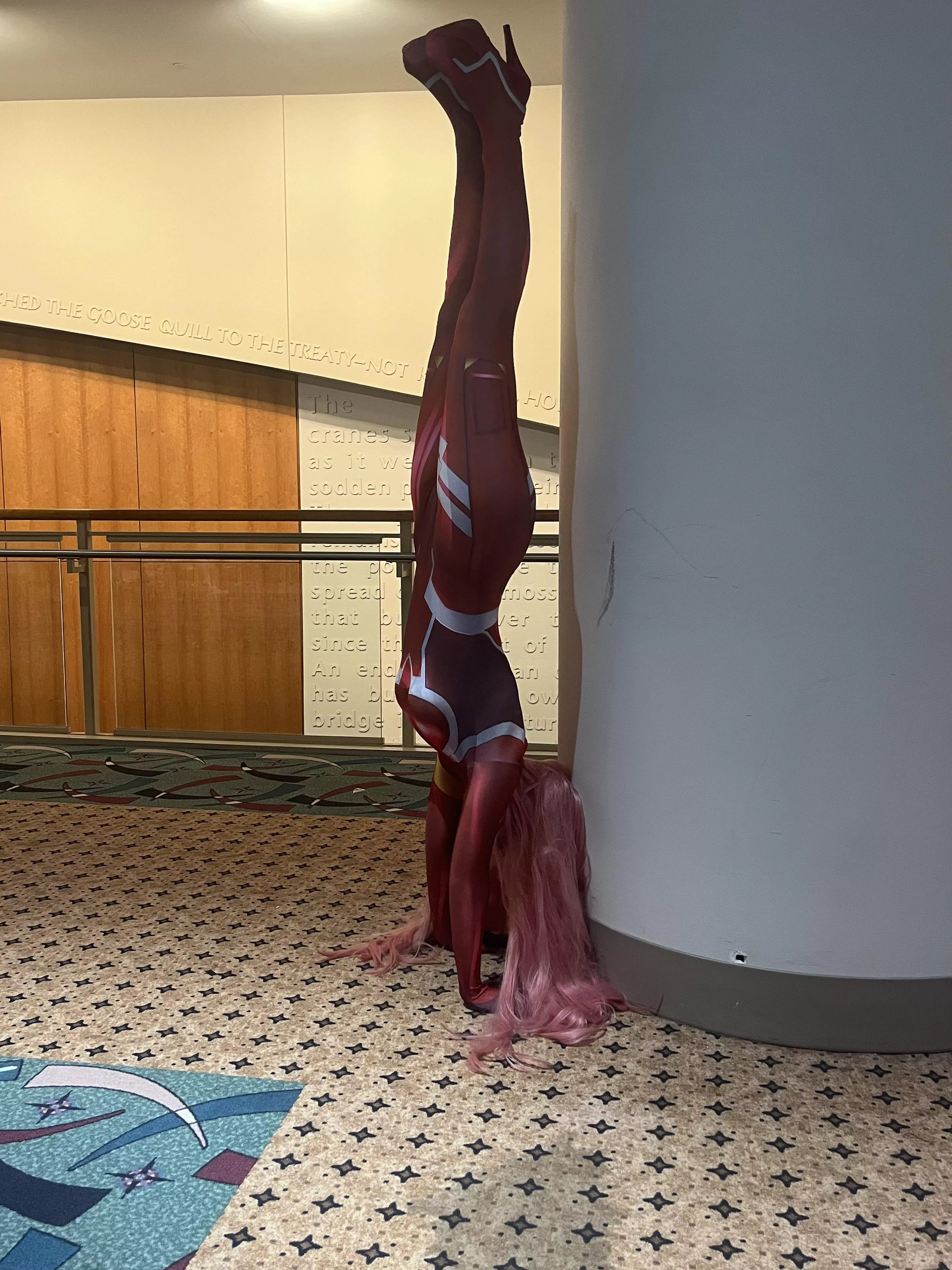 My 002 cosplay from Darling in the FRANXX doing a hand stand - cosplaykaty