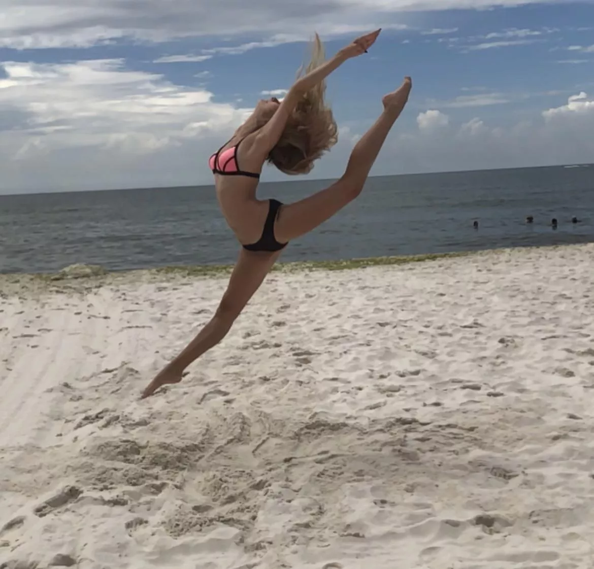Showing off my flexibility in my bikini at the beach