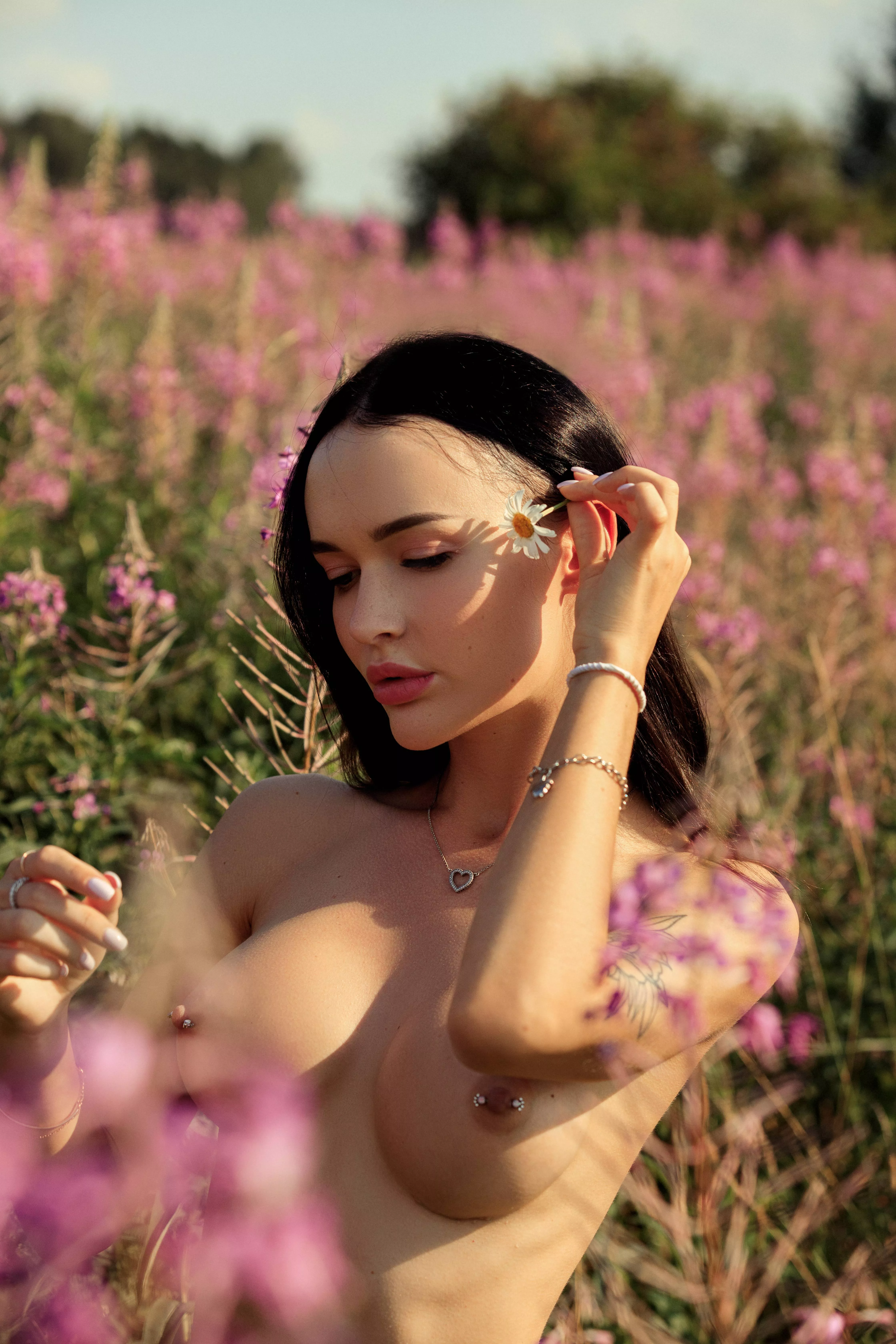 Lovely nymph shows her delicious fake boobs with tiny scars